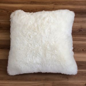 white faux fur pillow